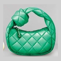 Green quilted top-handle handbag