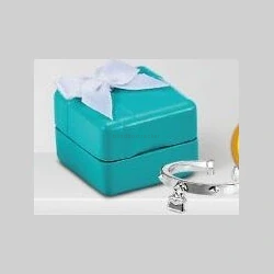 Turquoise tissue box with silver jewelry