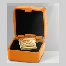 Orange jewelry box with gold jewelry