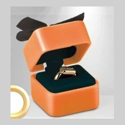 Orange jewelry box with silver watch